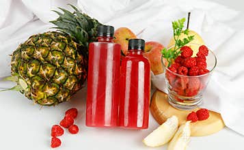 Tasty juice and organic fruit product in bottle and drink glass served for health care beverage cuisine of vegan party and summer