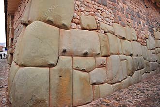 Hatun Rumiyoc street with Incan twelve angle stone in Cusco, Peru