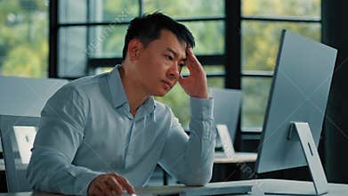 Asian businessman korean man work online at workplace difficult hard job get incorrect error in computer failure
