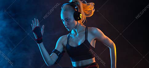 Fit woman on black background with neon lights. Fitness and sport motivation. Download banner for sports website or