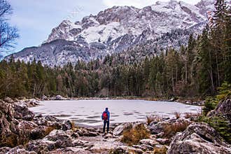 A man is looking into the wilderness