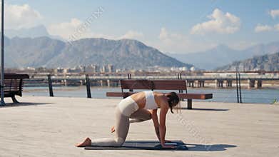 Caucasian beautiful woman doing yoga in the park. Be H3althy