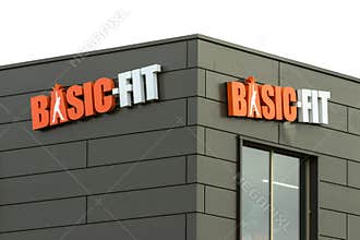Basic-Fit logo at the gym. BasicFit is the largest fitness chain in Europe.