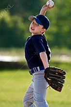 Young boy baseball pitcher