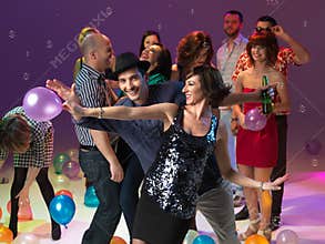 Young couple dancing at party