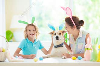 Mother and kid, family coloring Easter eggs