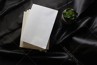 Blank front cover of paperback book or novel book in dark moody style in top view for cover mockup