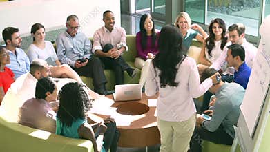Businesswoman Leading Brainstorming Session With Colleagues