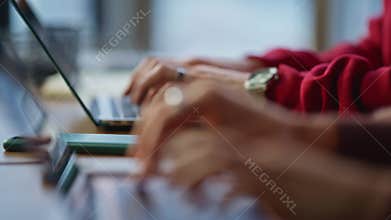 Programmers hands typing keyboard laptops at IT company office closeup.