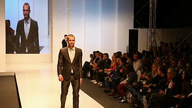 Male fashion models wearing suits