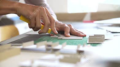 Time Lapse Of Architect Cutting Out Component For Model