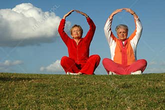 Senior women yoga outdoors