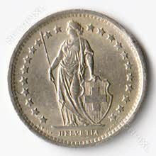 1968 Swiss 1 2 Franc coin featuring Helvetia with a spear and shield, surrounded by 23 stars.