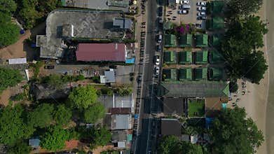 25.1.25 koh chang tha, cars on village road. Smooth aerial view flight drone