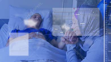 Patient lying in hospital bed, visitor holding hand, digital medical charts floating overhead
