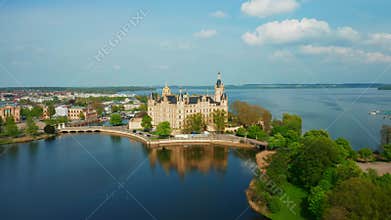 Stunning drone shot of Schwerin Castle with gardens and water in Germany