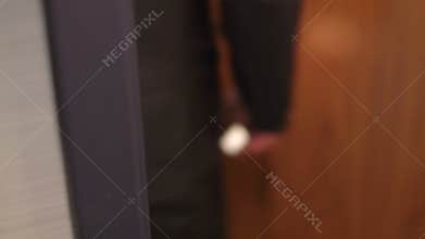 Man opens door using security key card