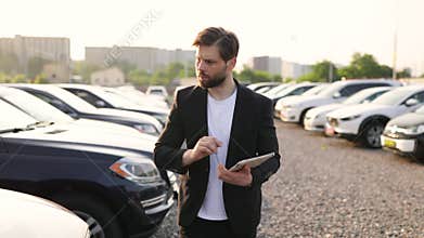 Car Dealer Showing Off New Vehicles