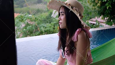 Photoshoot woman at poolside reflection of photography through the door glass