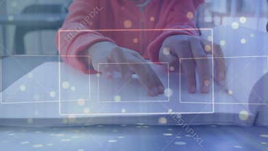 Boy placing fingertips on Braille for education tracing raised dots with animated boxes tracking