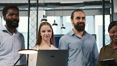 Portrait of smiling teamworking programmers utilizing AI to optimize performance
