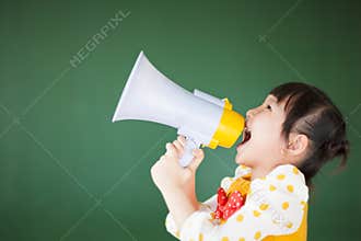 Happy child using a megaphone