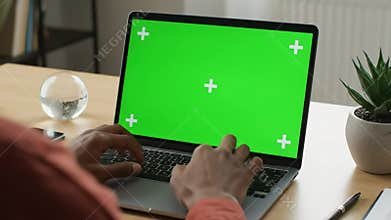 Working on Laptop with Green Screen at Home Office Green Screen Technology Concept