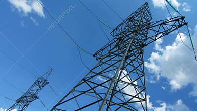 tall electric masts against cloudy sky - timelapse