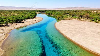 Crystal-clear artificial rivers flow through deserts, transforming barren land into thriving ecosystems. A vision of