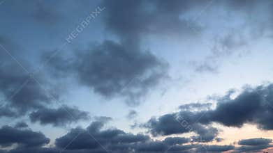moving dark clouds in the sky after sunset