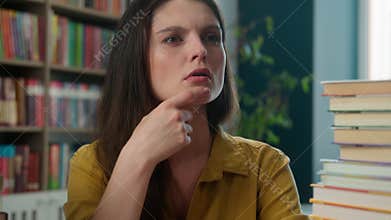 Thoughtful Caucasian woman think idea library learning girl clever high school student teacher tutor books author