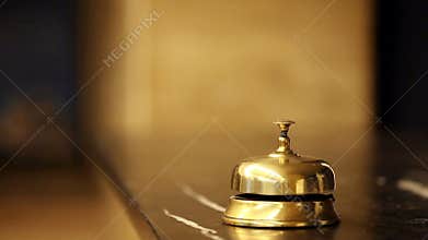 Call at old hotel bell on a marble stand