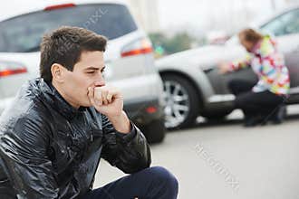 Upset man after car accident