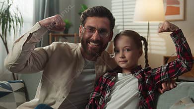 Happy Caucasian family funny smiling adult strong father with cute daughter dad man kid girl child at home at couch
