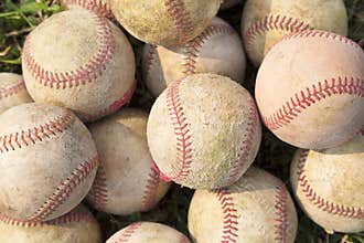 Pile up a stack of old baseball in green