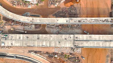 Drone footage of the scenic landscape of the construction site in Thailand. The concrete bridge building over the intersection