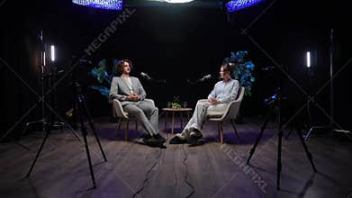 Influencers Engage in Deep Storytelling During a Podcast Recording in a Modern Studio