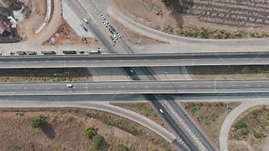 Drone footage of the scenic landscape of the construction site in Thailand. The concrete bridge building over the intersection