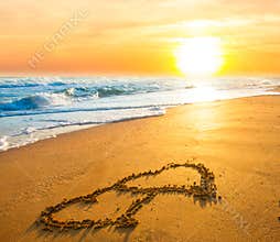 Two hearts on beach sand