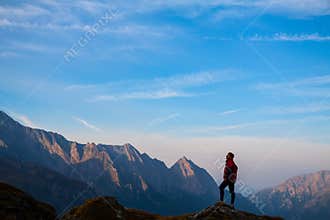 Sport women on the top of mountain