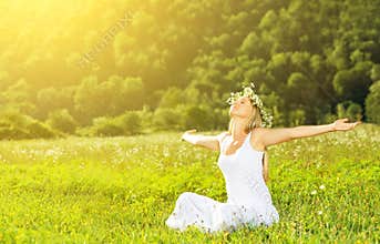 Happy woman in wreath outdoors summer enjoying life