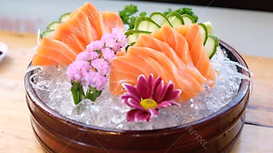 Elegant Salmon Sashimi Platter on Ice with Floral Garnish