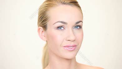 Blonde woman smiling facing forwards