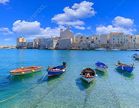 Giovinazzo old town in Apulia, Italy: view of the harbor from reef with the Cathedral of Santa Maria Assunta.