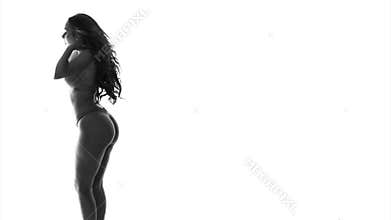 Silhouette of dancing woman in lingerie