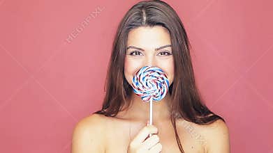 Beautiful woman with lollipop