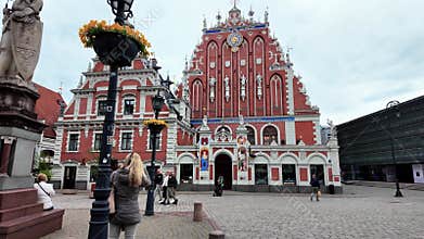 Scenic view of the House of the Blackheads in Riga with tourists gathered in the square