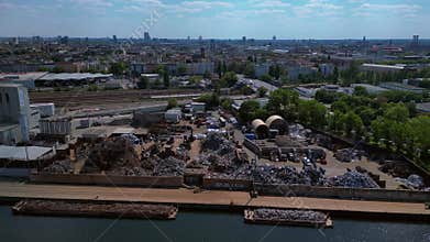Scrap metal recycling center sorting waste. Smooth aerial view flight drone