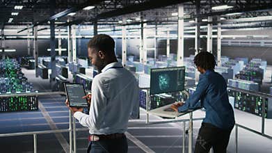Data center programmers on industrial platform checking lines of code