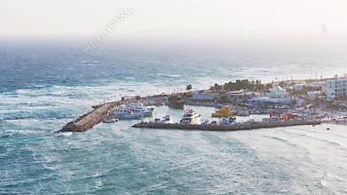 Aerial View of Ayia Napa Harbor with Boats and Coastal Resorts